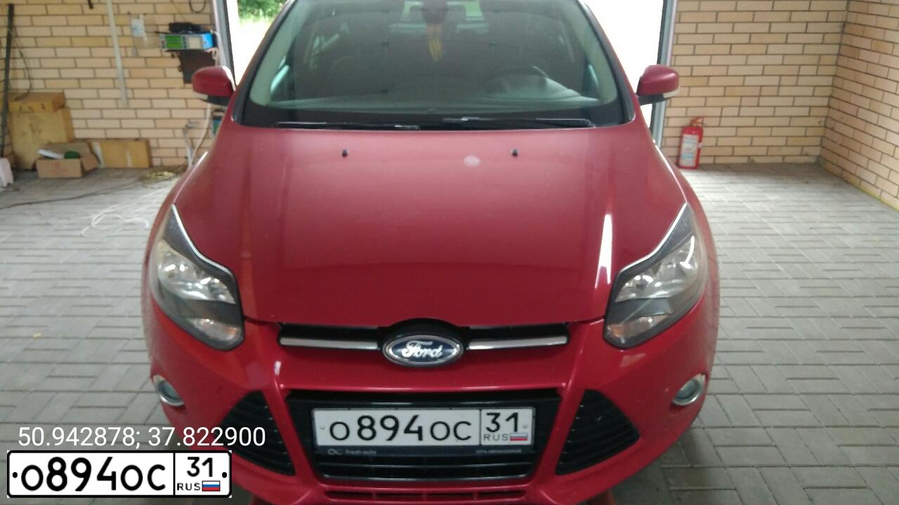 Фото автомобиля FORD FOCUS, 2012 — госномер Н989ТН31. Цвет: Красный