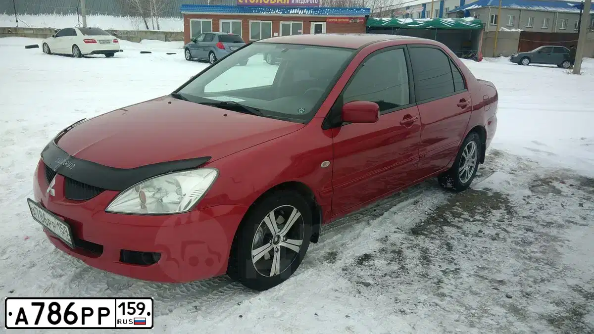 Фото автомобиля MITSUBISHI LANCER, 2006 — госномер Н537АТ196. Цвет: Красный
