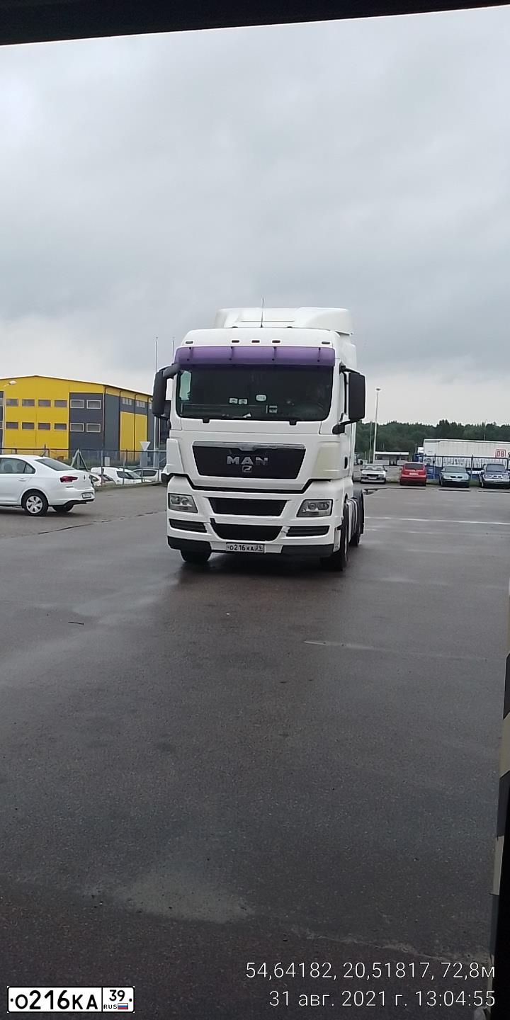 Фото автомобиля MAN TGX 18.XXX /4X2/, 2008 — госномер О216КА39. Цвет: Белый