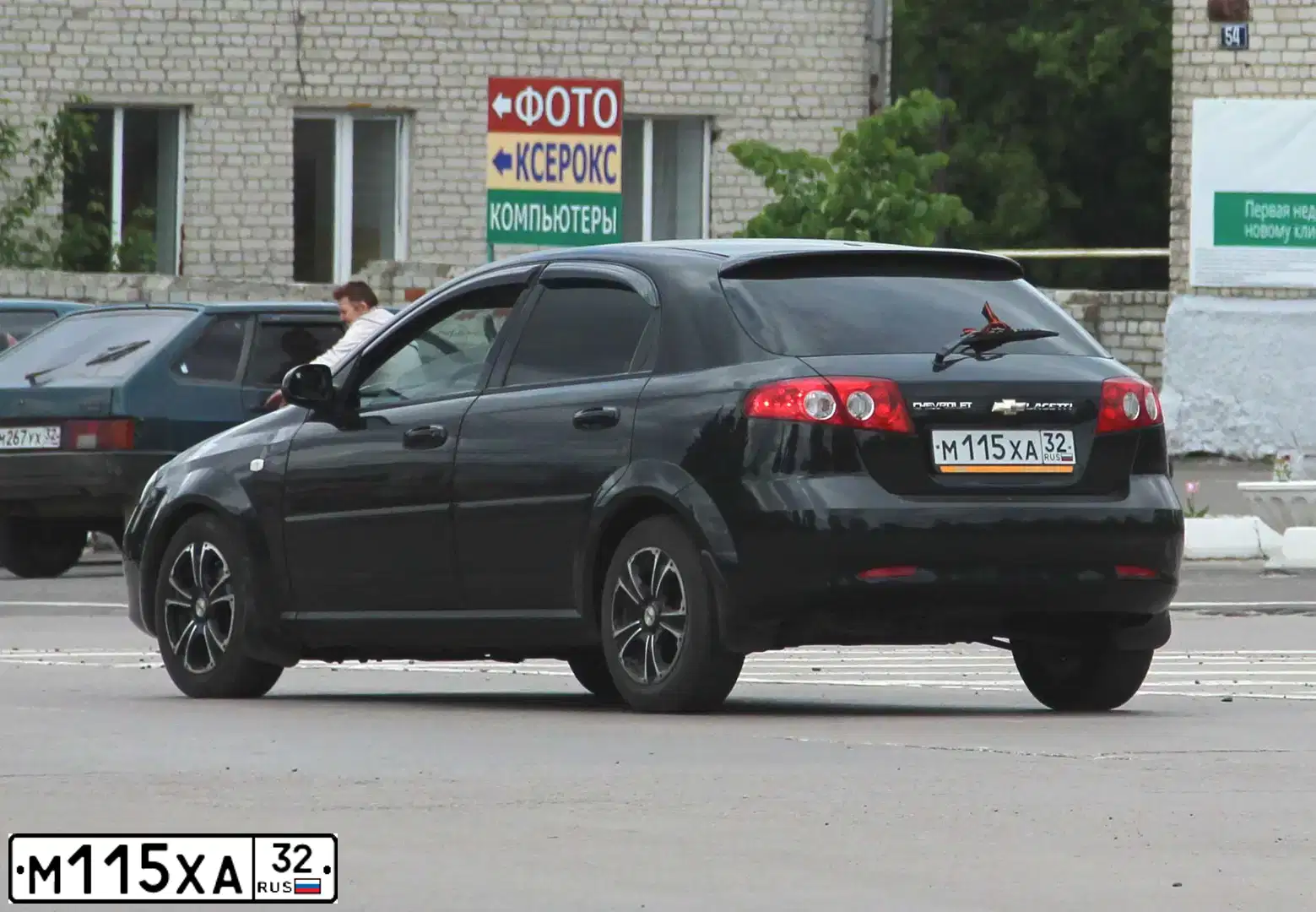 Фото автомобиля CHEVROLET LACETTI, 2007 — госномер М115ХА32. Цвет: ЧЕРНЫЙ