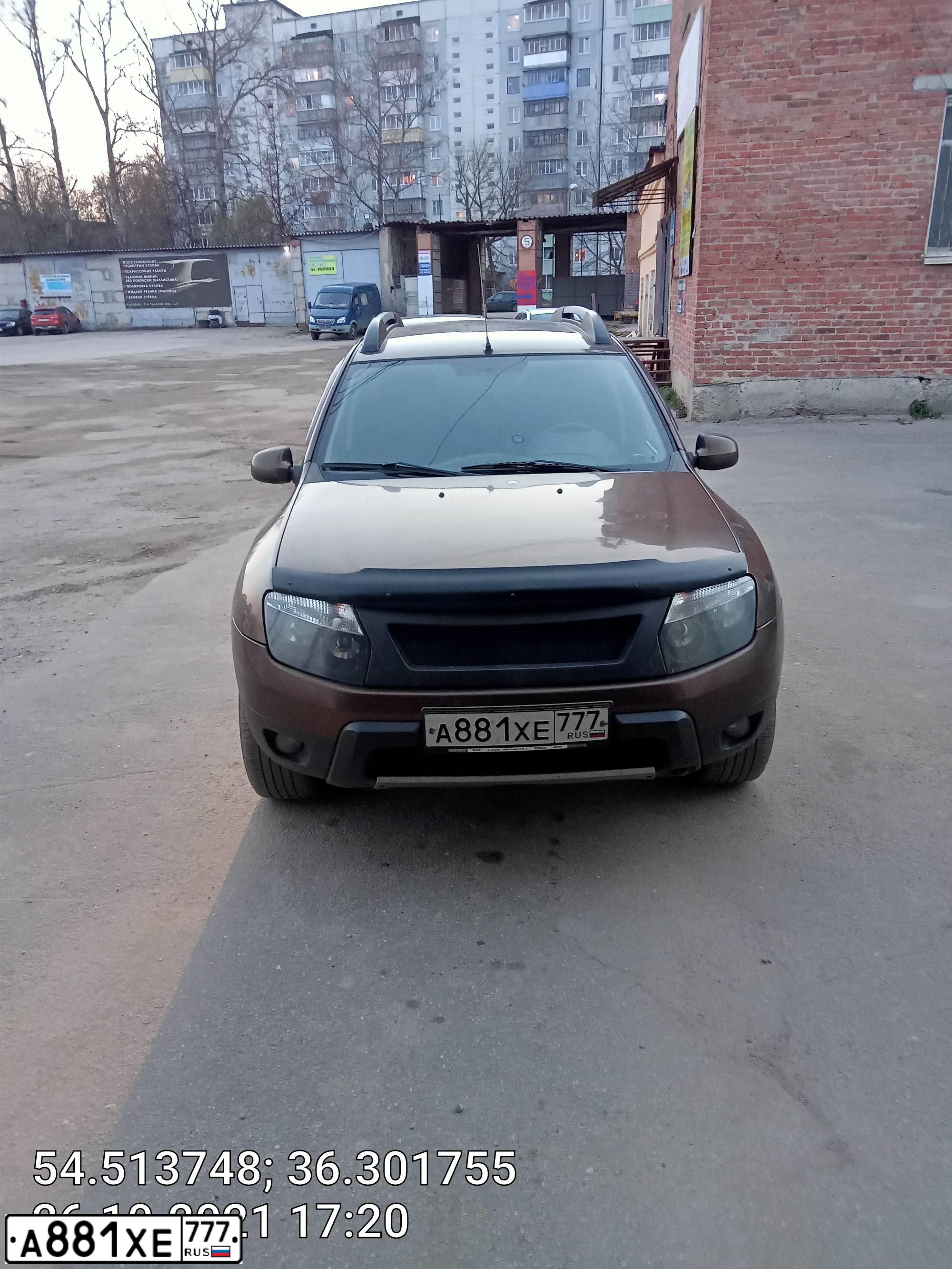 Фото автомобиля RENAULT DUSTER, 2012 — госномер Е974УУ197. Цвет: Коричневый