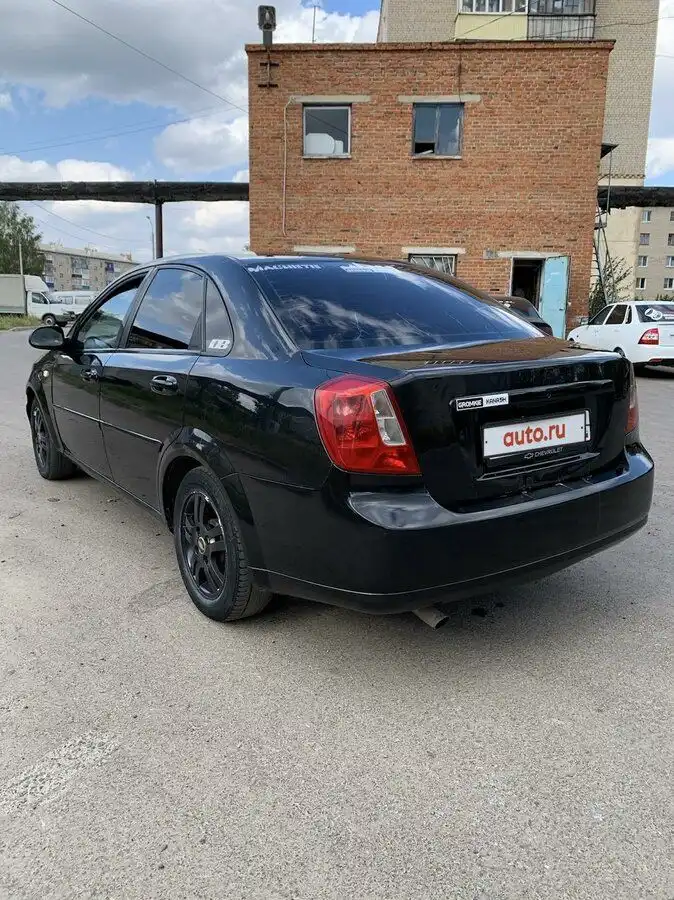 Фото автомобиля CHEVROLET LACETTI, 2008 — госномер К702СК21. Цвет: ЧЕРНЫЙ