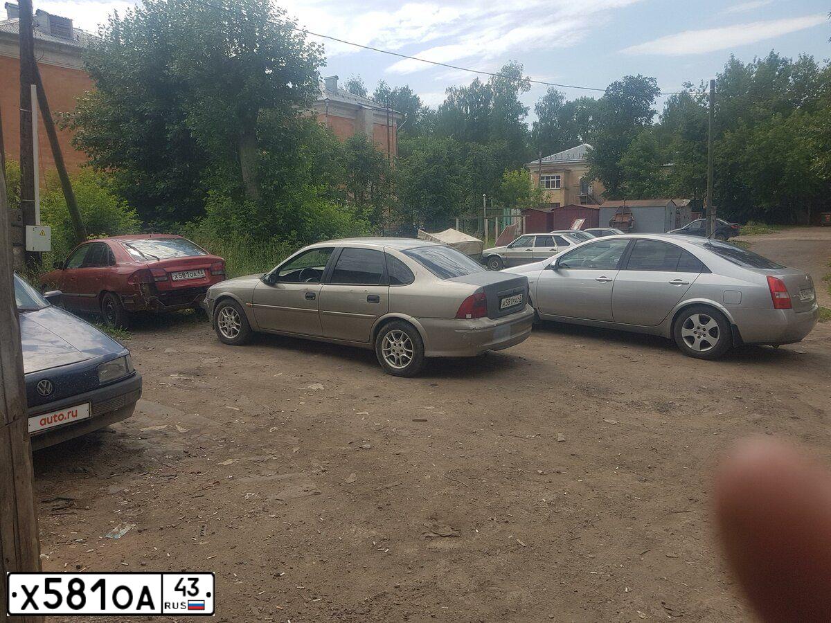 Фото автомобиля МАЗДА 626 2.0, 1998 — госномер С143ВУ774. Цвет: КРАСНЫЙ