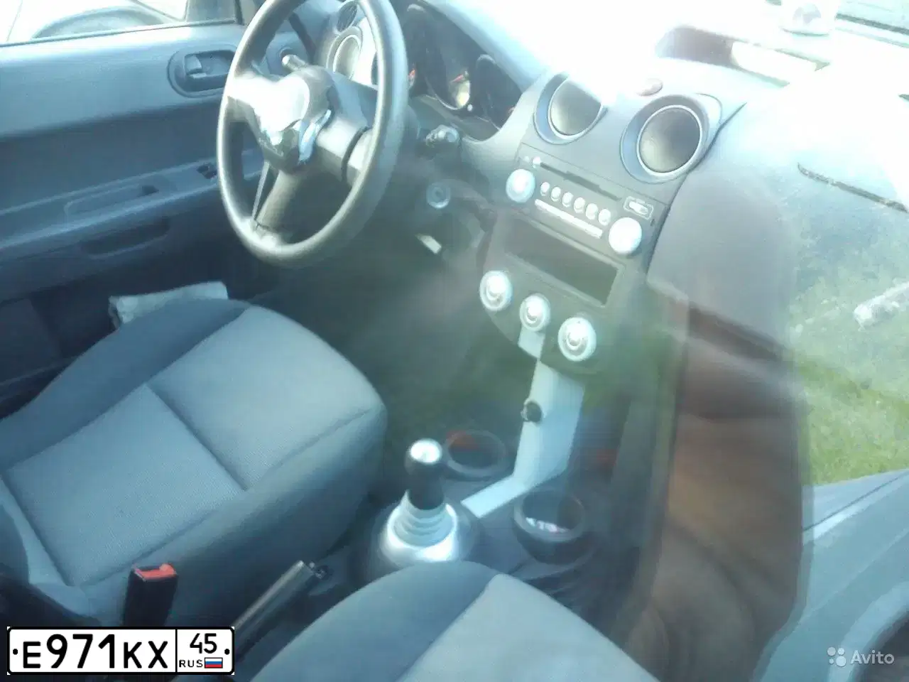 Фото автомобиля MITSUBISHI COLT, 2006 — госномер Е971КХ45. Цвет: серебристый