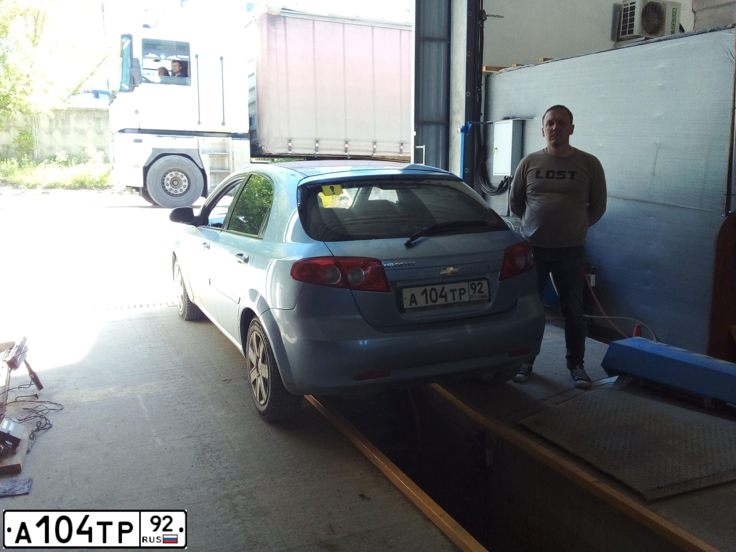 Фото автомобиля CHEVROLET LACETTI, 2009 — госномер М191АР185. Цвет: голубой