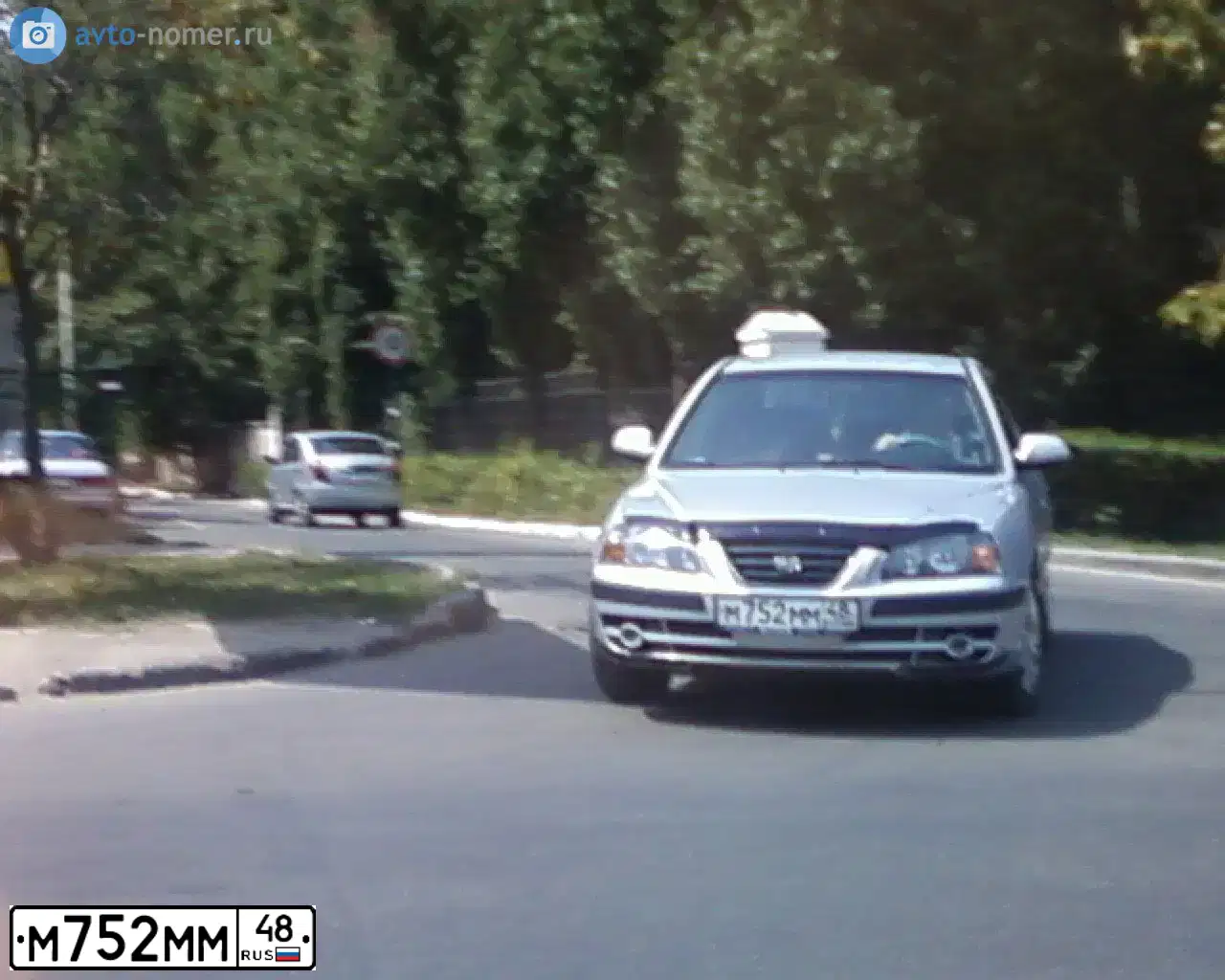Фото автомобиля FORD FOCUS, 2012 — госномер М013РХ48. Цвет: СЕРО-КОРИЧНЕВЫЙ