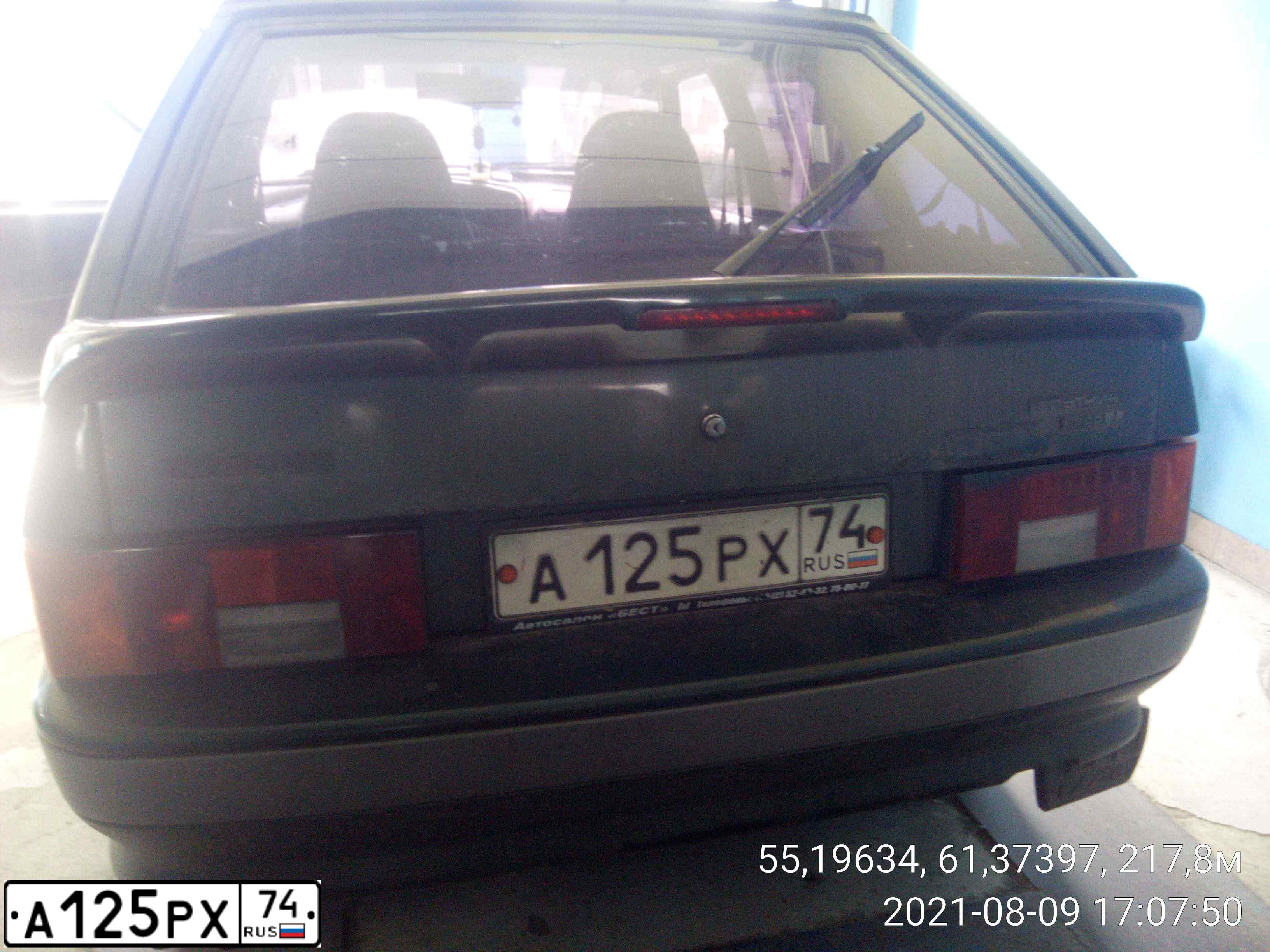 Фото автомобиля LADA 2114 SAMARA, 2004 — госномер А125РХ74. Цвет: ТЕМНО-ЗЕЛЕНЫЙ
