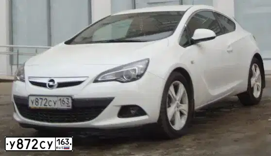 Фото автомобиля OPEL ASTRA GTC, 2013 — госномер К856ТТ134. Цвет: Белый