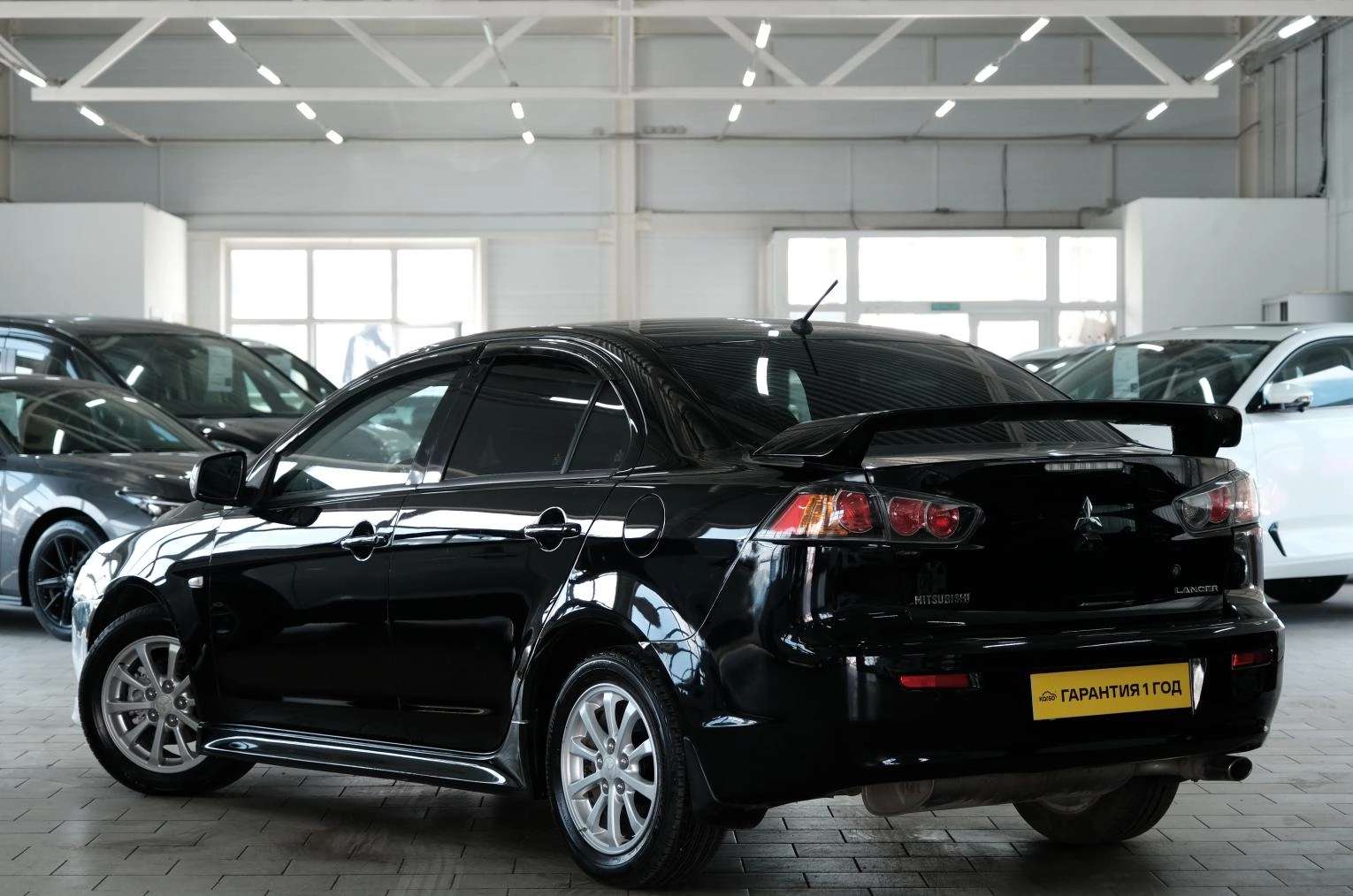 Фото автомобиля MITSUBISHI LANCER, 2010 — госномер В357АС155. Цвет: ЧЕРНЫЙ