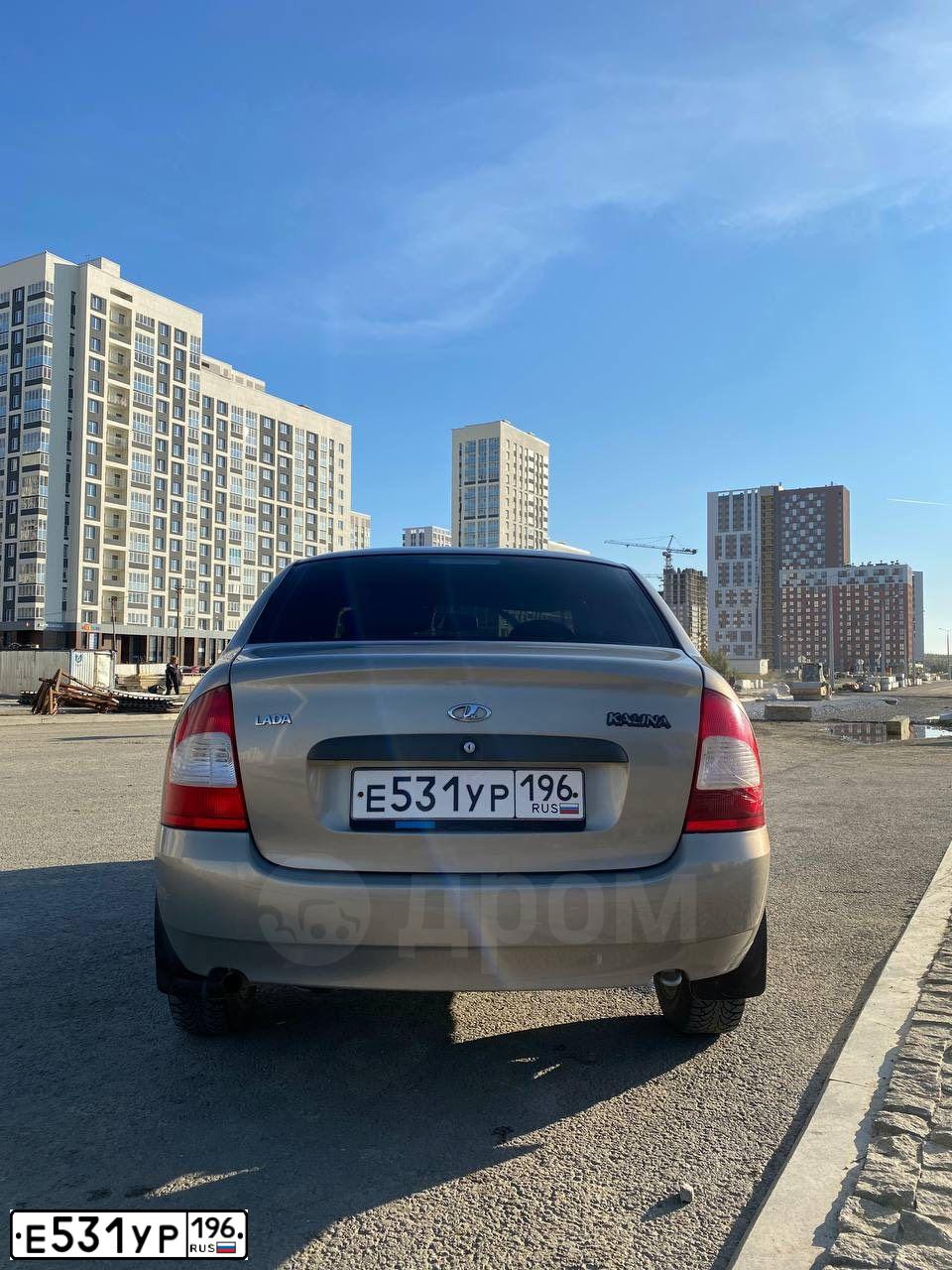 Фото автомобиля LADA 1118 KALINA, 2006 — госномер Е557МК702. Цвет: Серый