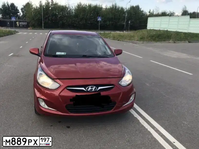 Фото автомобиля HYUNDAI SOLARIS, 2011 — госномер Е156МС14. Цвет: КРАСНЫЙ ГРАНАТ