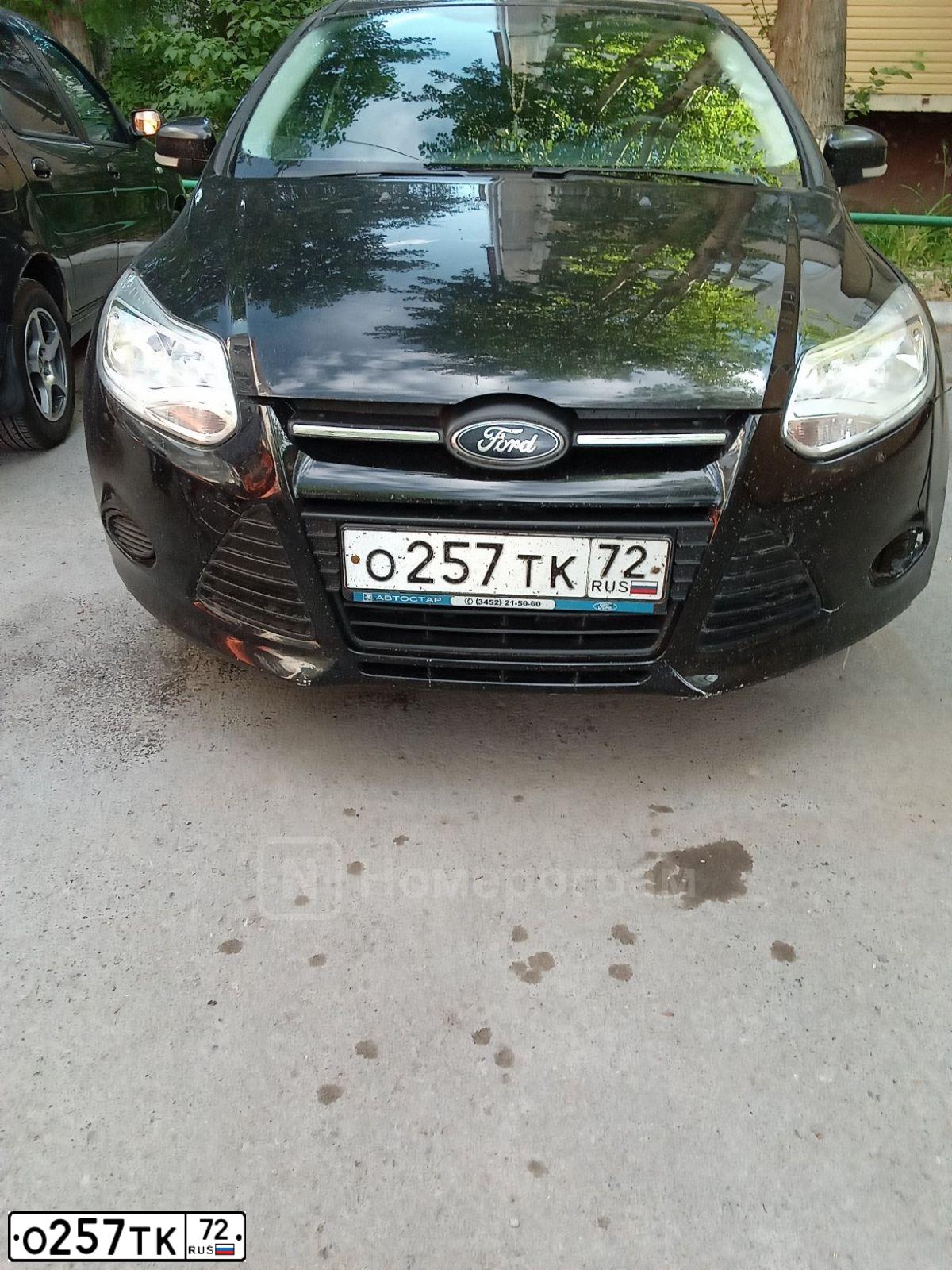 Фото автомобиля FORD FOCUS, 2012 — госномер О257ТК72. Цвет: черный