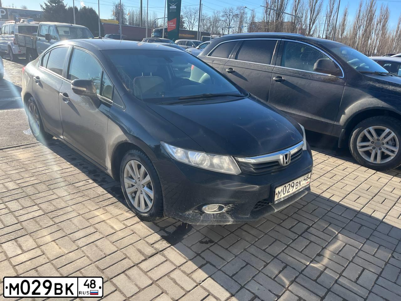 Фото автомобиля HONDA CIVIC, 2012 — госномер М029ВК48. Цвет: ЧЕРНЫЙ