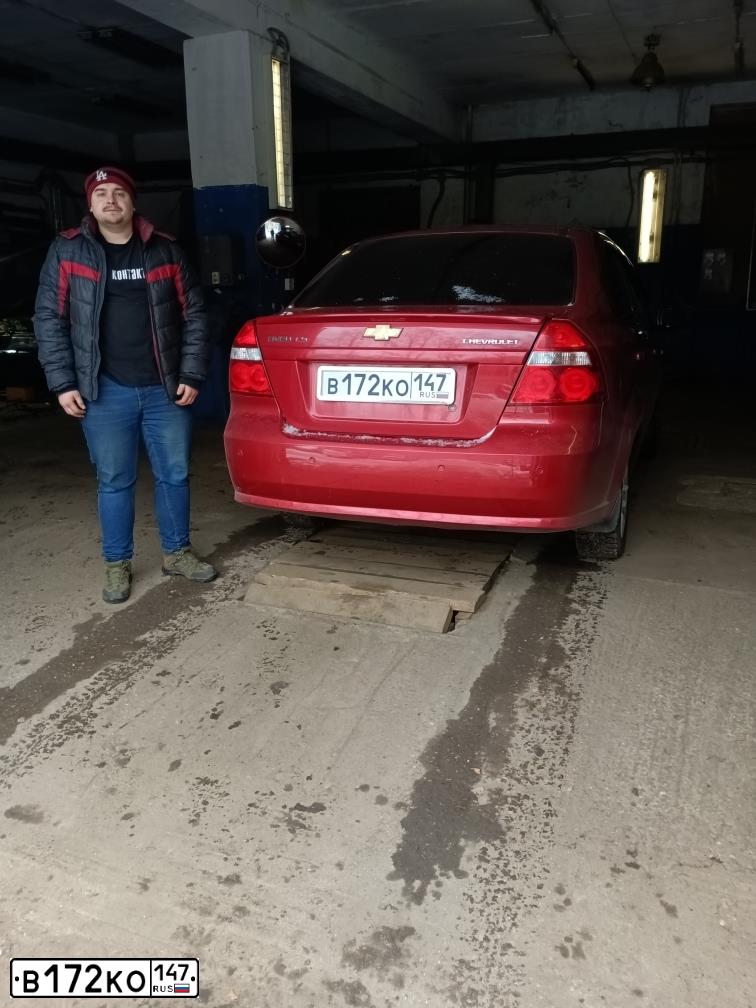 Фото автомобиля CHEVROLET AVEO, 2011 — госномер В742УЕ69. Цвет: Красный