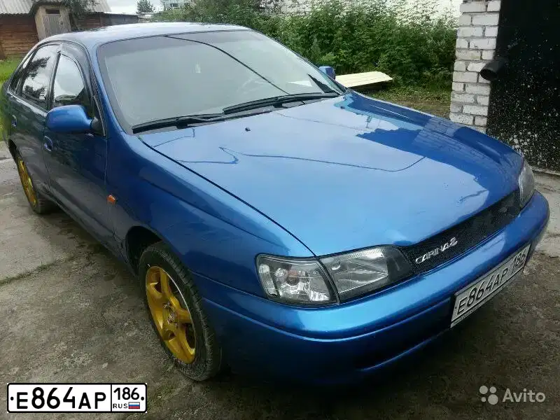 Фото автомобиля TOYOTA CARINA, 1992 — госномер В011МН45. Цвет: синий