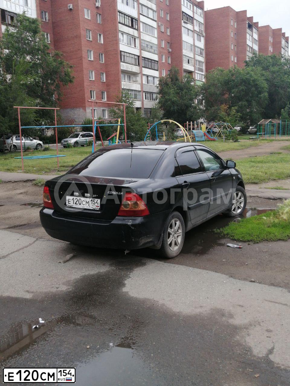 Фото автомобиля TOYOTA COROLLA, 2004 — госномер Е120СМ154. Цвет: ЧЕРНЫЙ