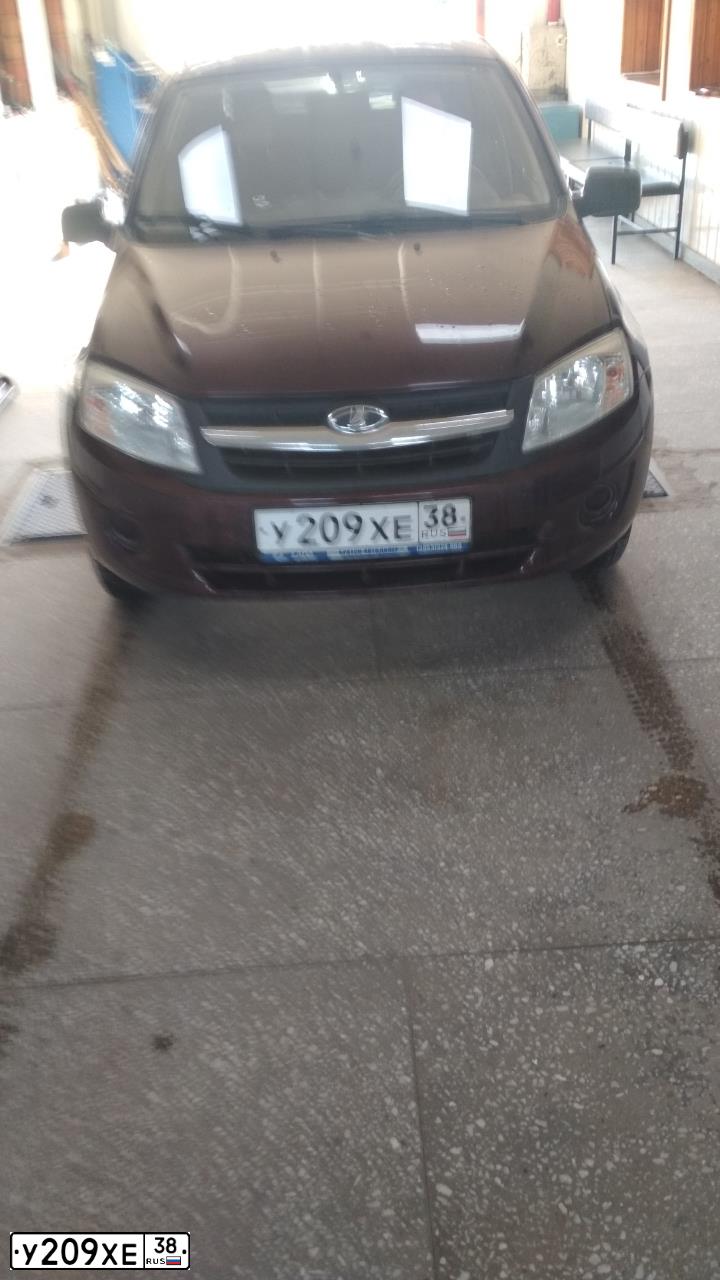 Фото автомобиля LADA 2190 GRANTA, 2012 — госномер У209ХЕ38. Цвет: ТЕМНО-ВИШНЕВЫЙ