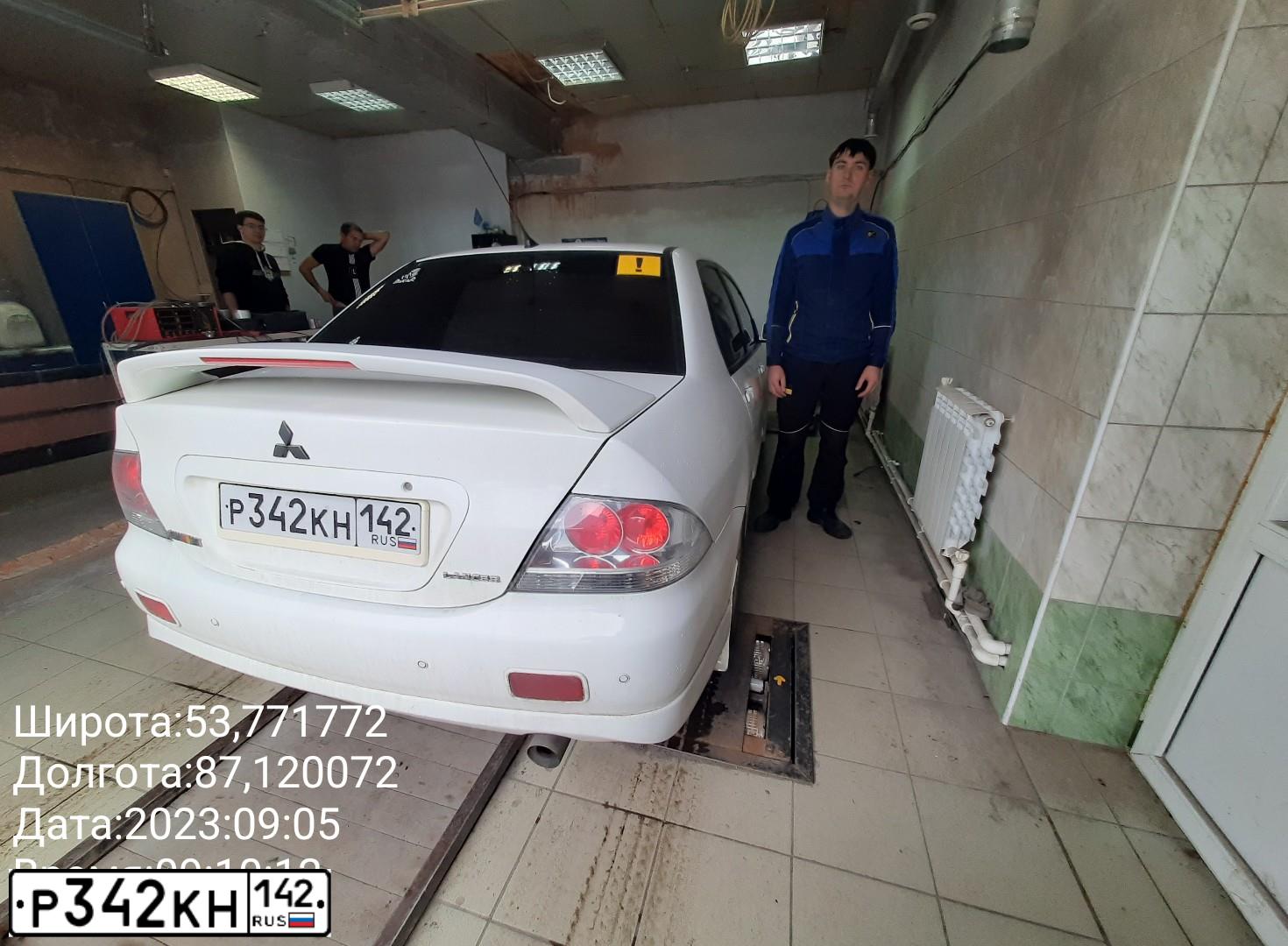 Фото автомобиля MITSUBISHI LANCER, 2006 — госномер Т538НС142. Цвет: Белый