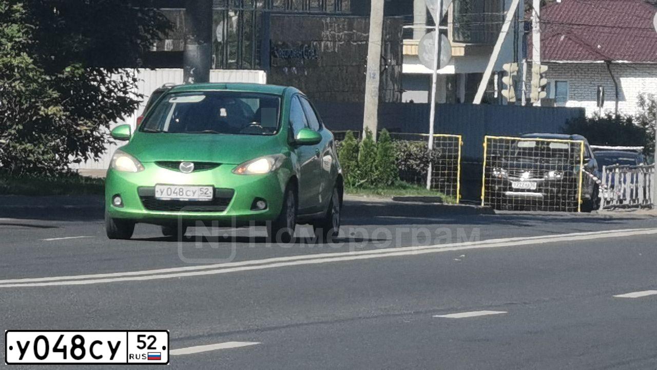 Фото автомобиля MAZDA 2, 2008 — госномер У048СУ52. Цвет: ЗЕЛЕНЫЙ