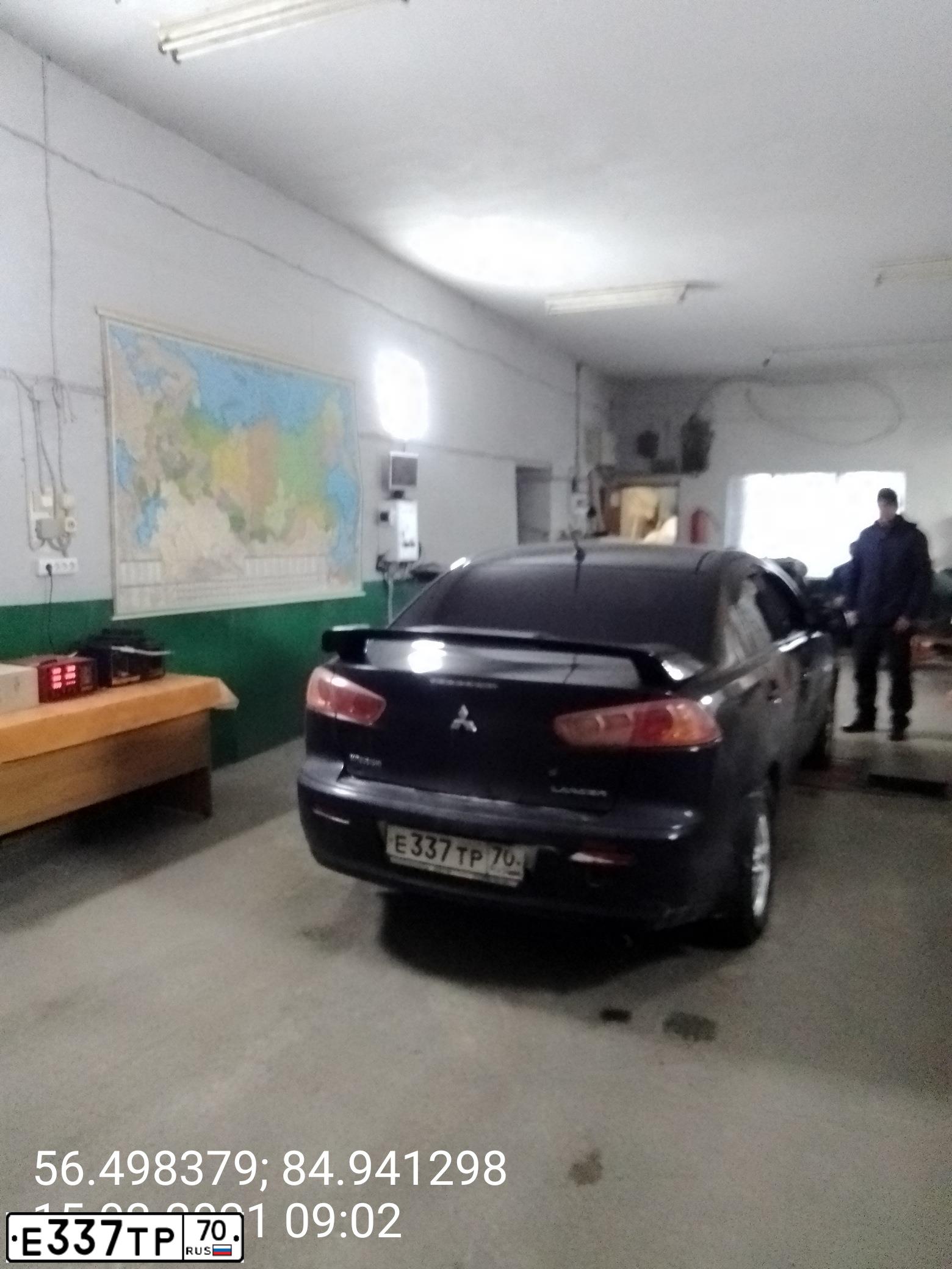 Фото автомобиля MITSUBISHI LANCER, 2007 — госномер Е337ТР70. Цвет: ЧЕРНЫЙ