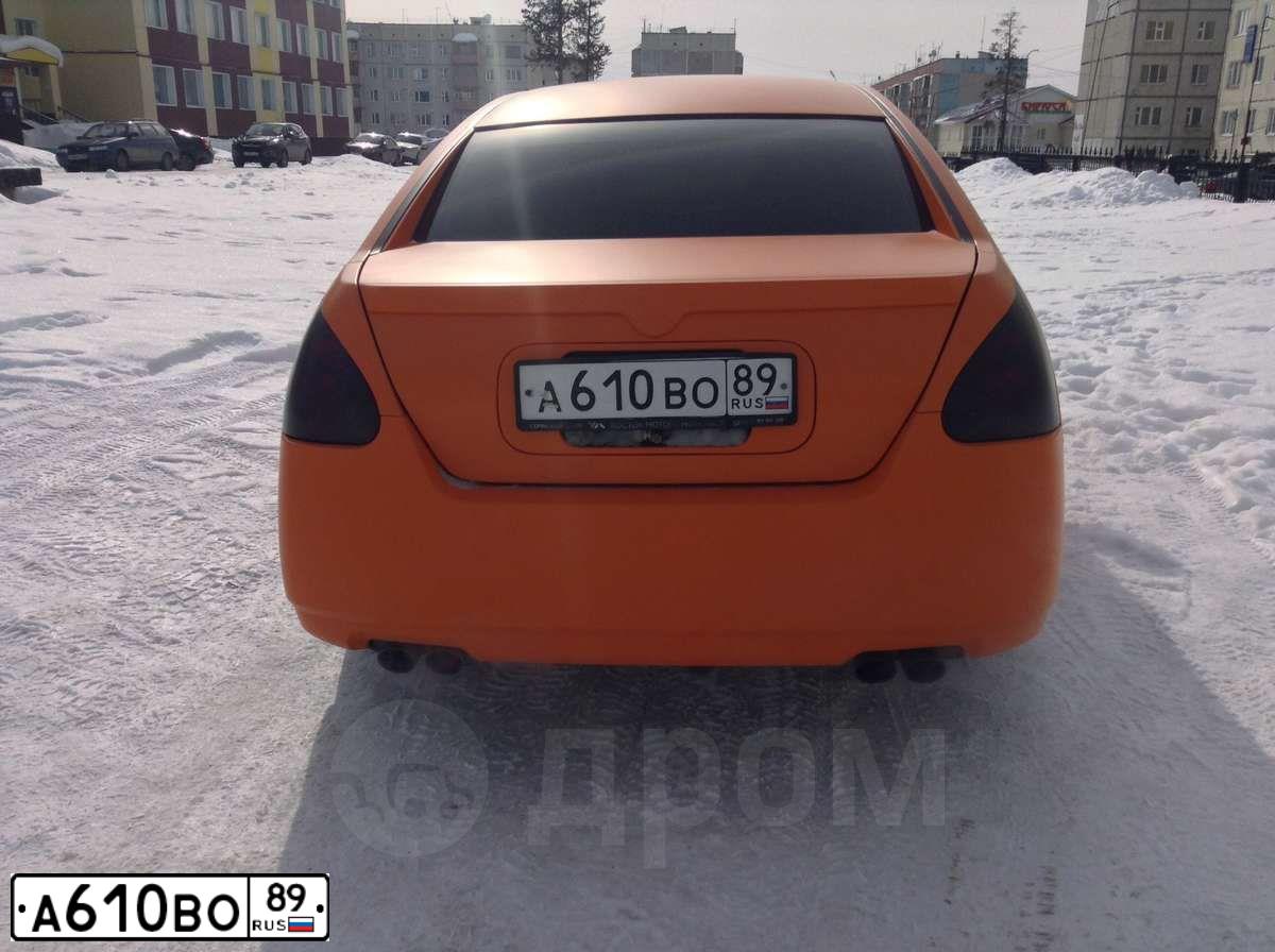 Фото автомобиля NISSAN MAXIMA, 2004 — госномер А010РР72. Цвет: ОРАНЖЕВЫЙ
