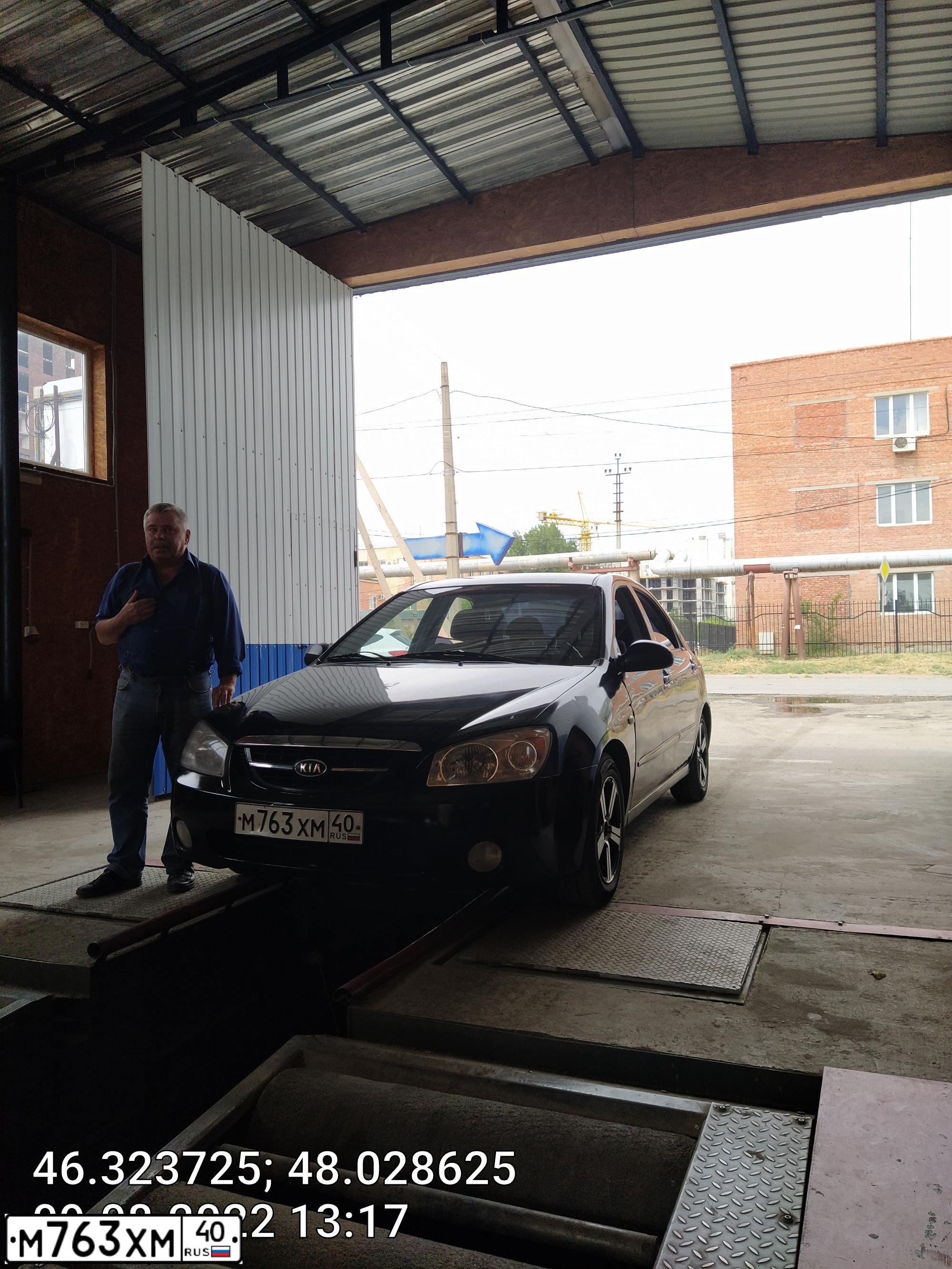 Фото автомобиля KIA CERATO, 2006 — госномер В867НН30. Цвет: ЧЕРНЫЙ