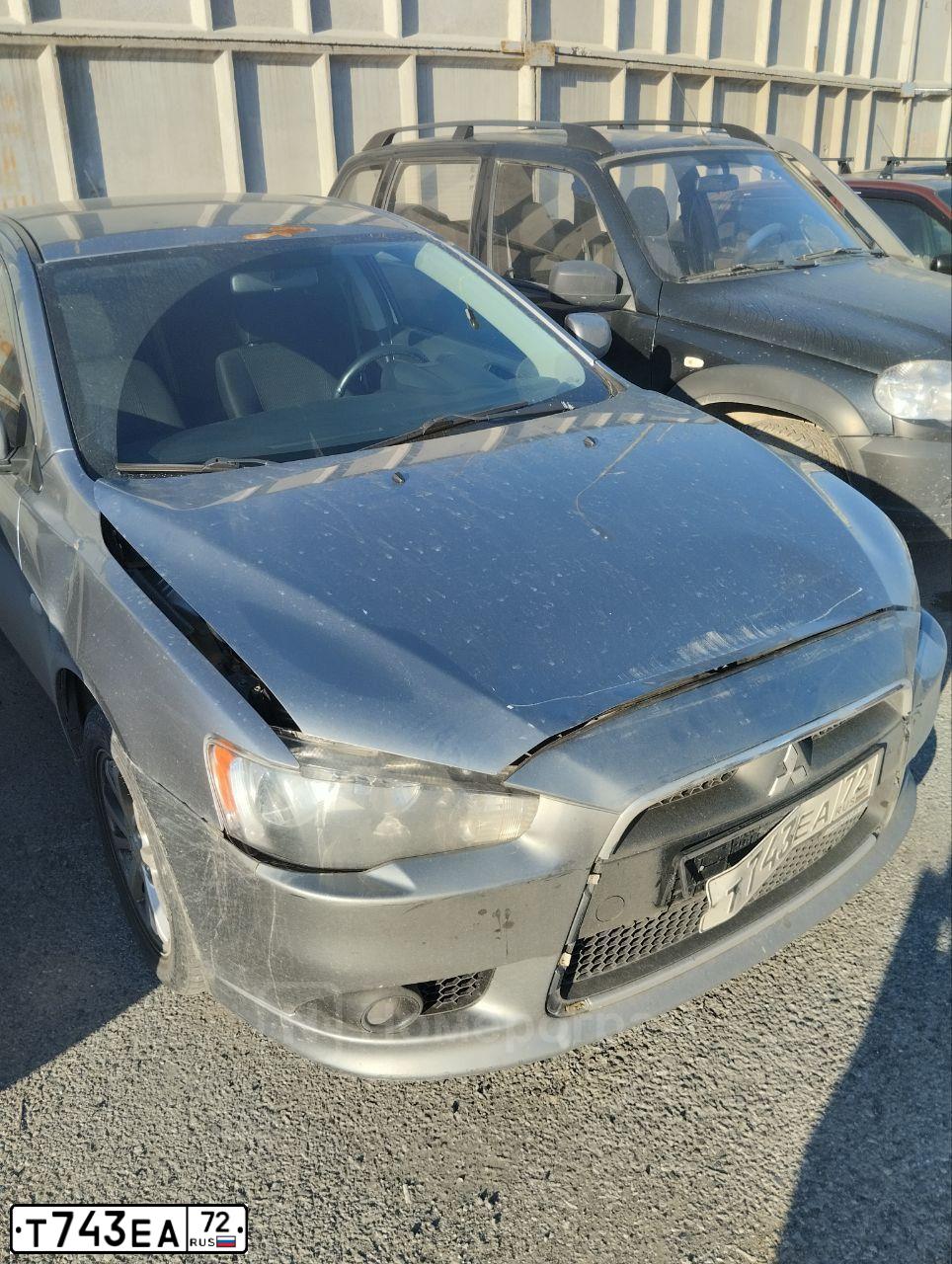 Фото автомобиля MITSUBISHI LANCER, 2012 — госномер Т743ЕА72. Цвет: СЕРЫЙ
