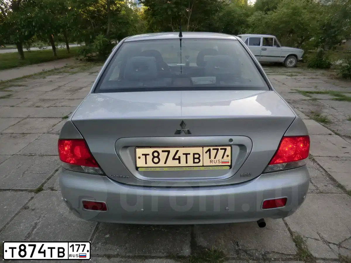 Фото автомобиля MITSUBISHI LANCER, 2005 — госномер В117КВ92. Цвет: СЕРЕБРИСТЫЙ