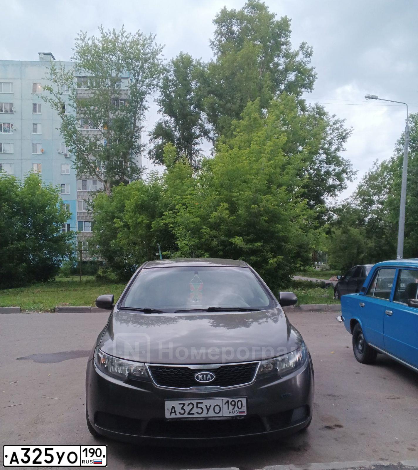 Фото автомобиля KIA CERATO, 2010 — госномер Е118ОС62. Цвет: БРОНЗОВЫЙ