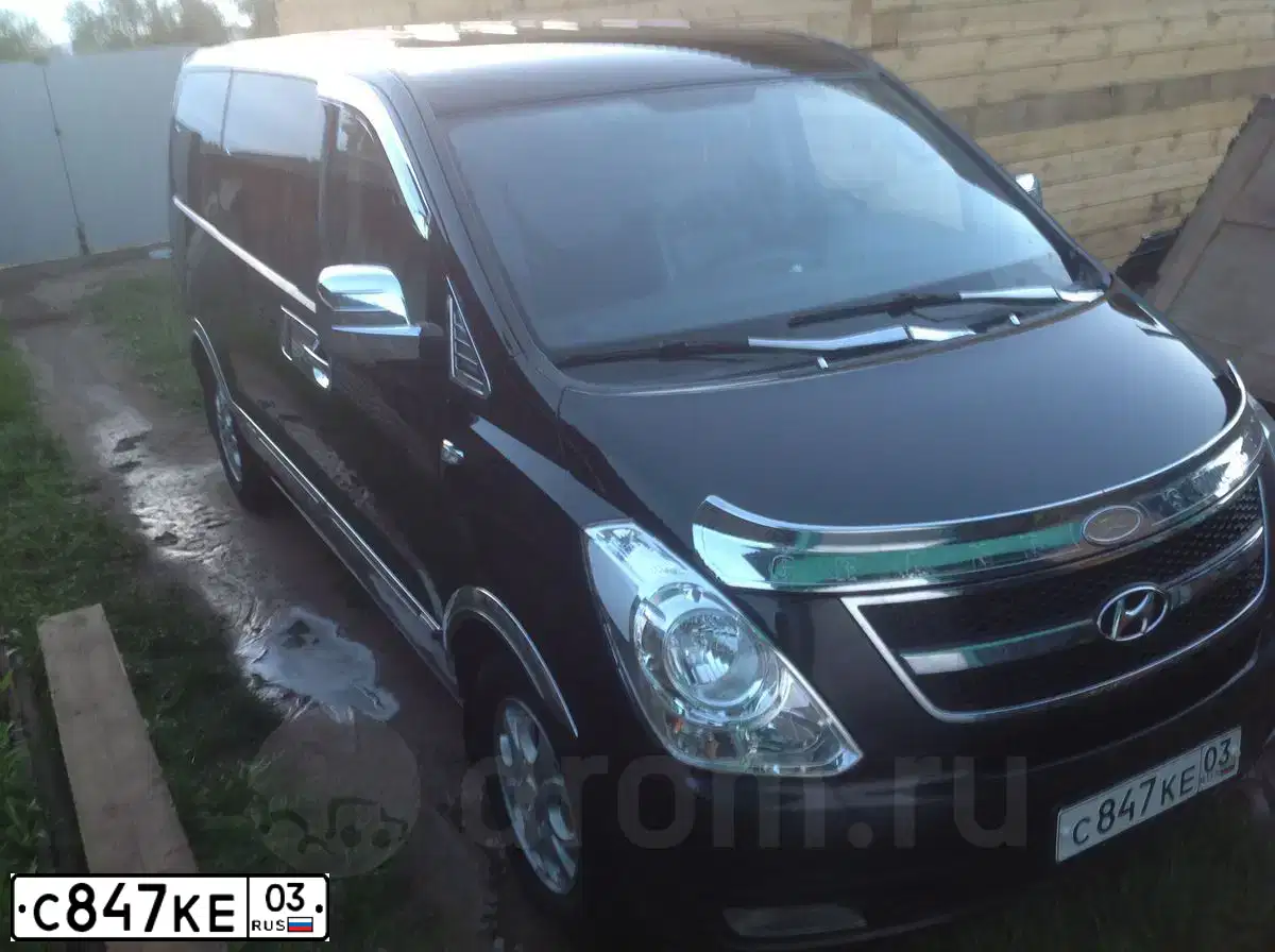 Фото автомобиля HYUNDAI GRAND STAREX, 2009 — госномер А023ВН702. Цвет: ЧЕРНЫЙ