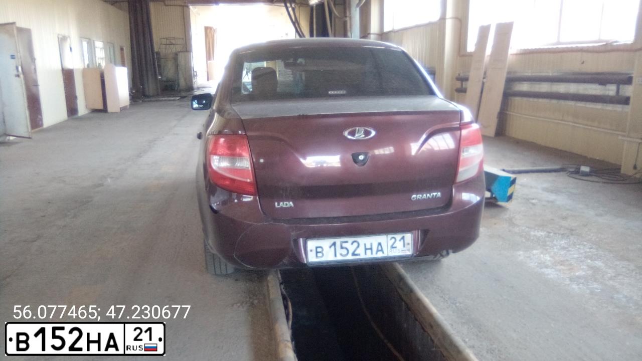 Фото автомобиля LADA 2190 GRANTA, 2012 — госномер В152НА21. Цвет: ТЕМНО-ВИШНЕВЫЙ