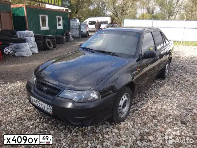 Фото автомобиля DAEWOO O NEXIA, 2011 — госномер Х409ОУ69. Цвет: Бледно-Черный