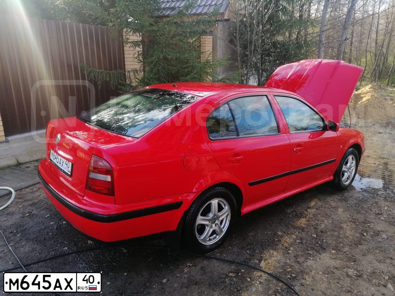 Фото автомобиля SKODA OCTAVIA, 1999 — госномер М645АХ40. Цвет: Красный