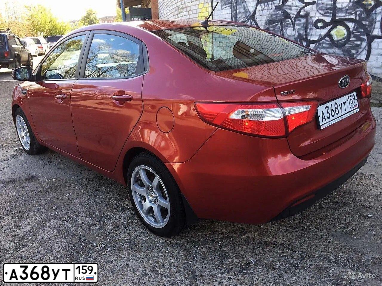 Фото автомобиля KIA RIO, 2012 — госномер О597ТМ159. Цвет: Красный