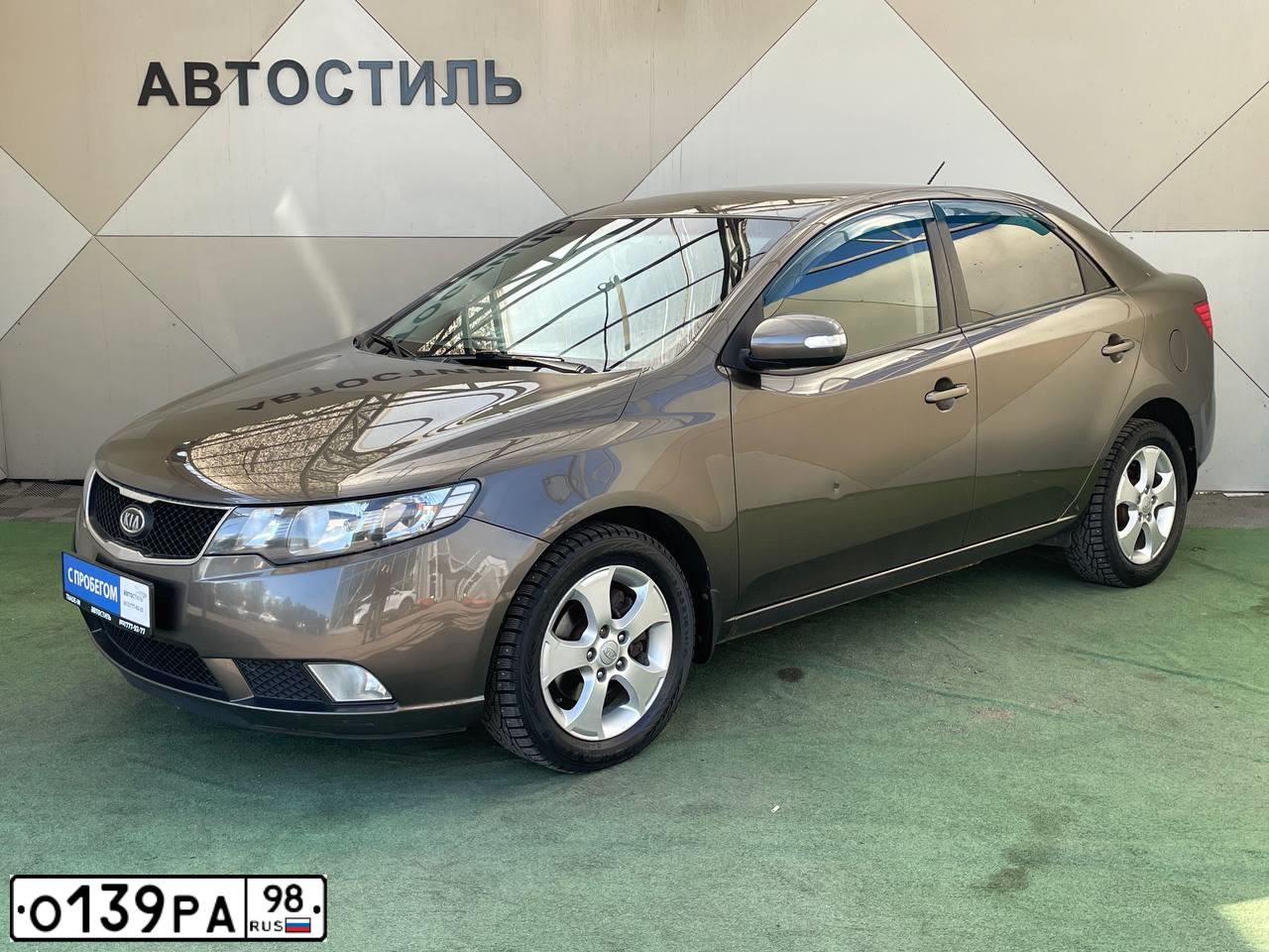 Фото автомобиля KIA CERATO, 2010 — госномер Е788ЕВ11. Цвет: бронзовый