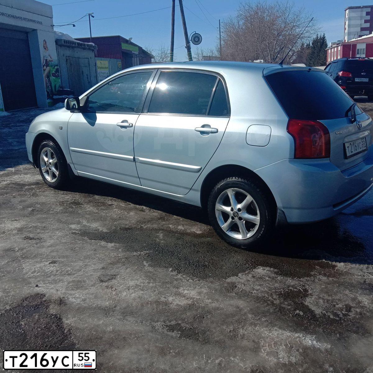 Фото автомобиля TOYOTA COROLLA, 2005 — госномер Т216УС55. Цвет: ГОЛУБОЙ