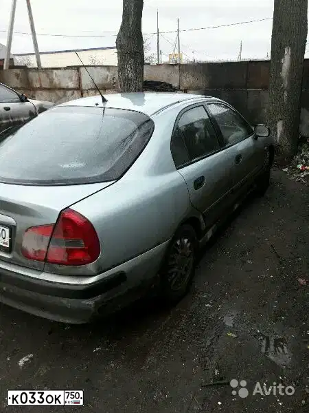Фото автомобиля MITSUBISHI CARISMA, 2002 — госномер Е174МН790. Цвет: СВЕТЛО СЕРО-ЗЕЛЕНЫЙ