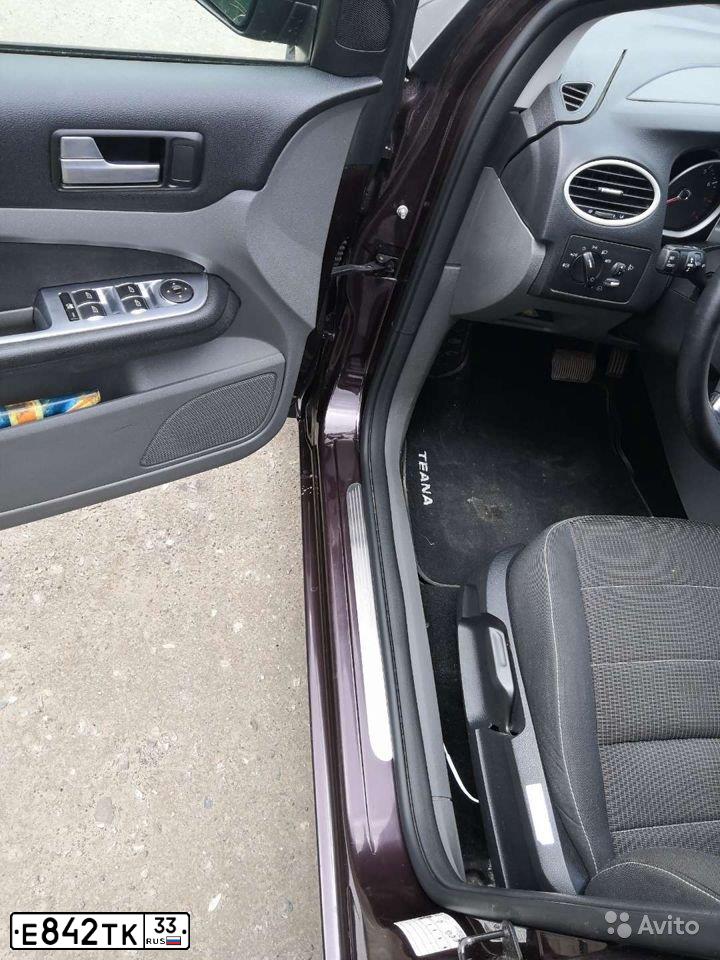 Фото автомобиля RENAULT SANDERO, 2012 — госномер Е842ТК33. Цвет: Красный