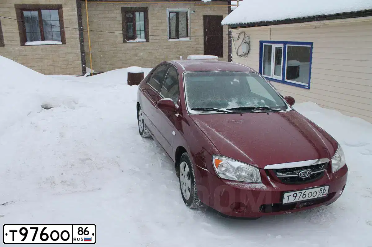 Фото автомобиля KIA CERATO, 2005 — госномер Р361ХА72. Цвет: ТЕМНО-КРАСНЫЙ