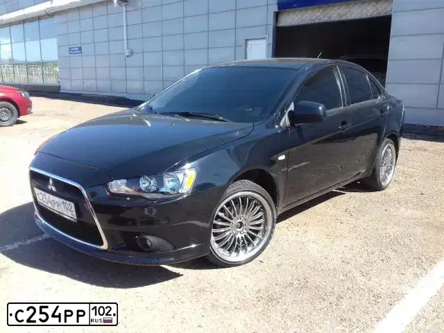 Фото автомобиля MITSUBISHI LANCER, 2012 — госномер С254РР102. Цвет: ЧЕРНЫЙ