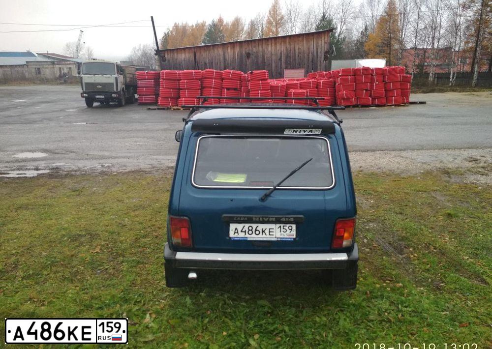 Фото автомобиля LADA 2121 NIVA, 2011 — госномер Т305ТЕ26. Цвет: Сине-зеленый