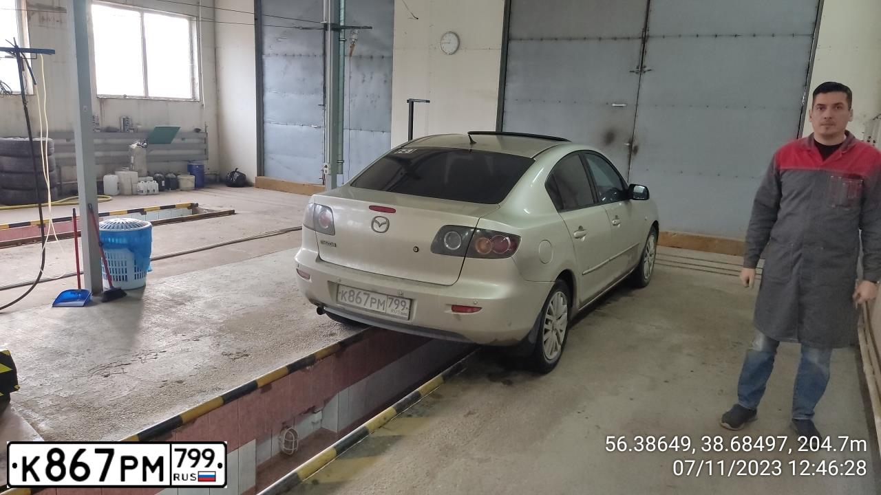 Фото автомобиля MAZDA 3, 2006 — госномер О448ЕХ177. Цвет: СЕРО-ЗОЛОТИСТЫЙ