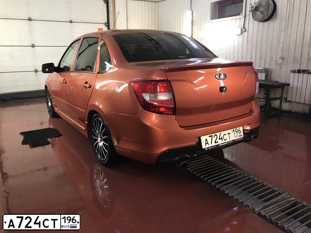Фото автомобиля LADA 2190 GRANTA, 2014 — госномер А697МО45. Цвет: Оранжевый