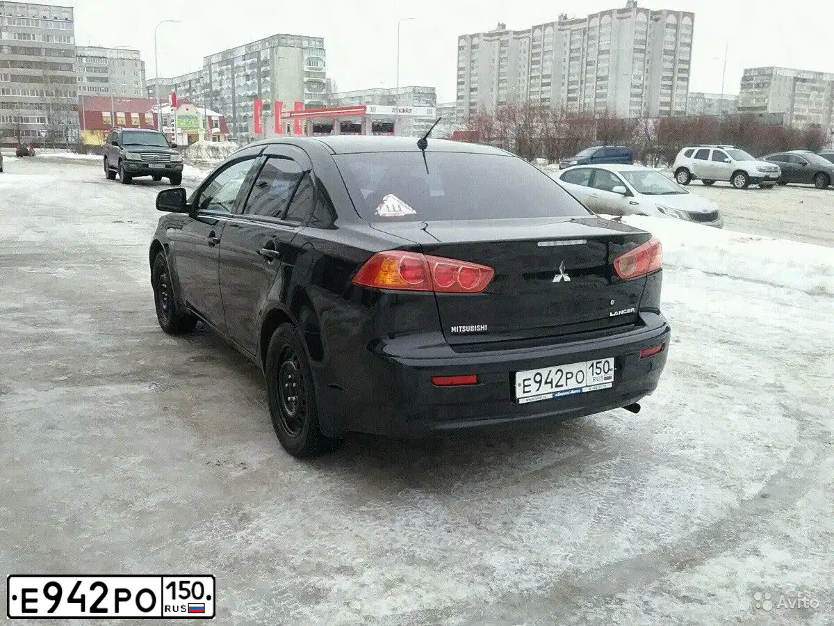 Фото автомобиля MITSUBISHI LANCER, 2008 — госномер Т066ХА12. Цвет: ЧЕРНЫЙ
