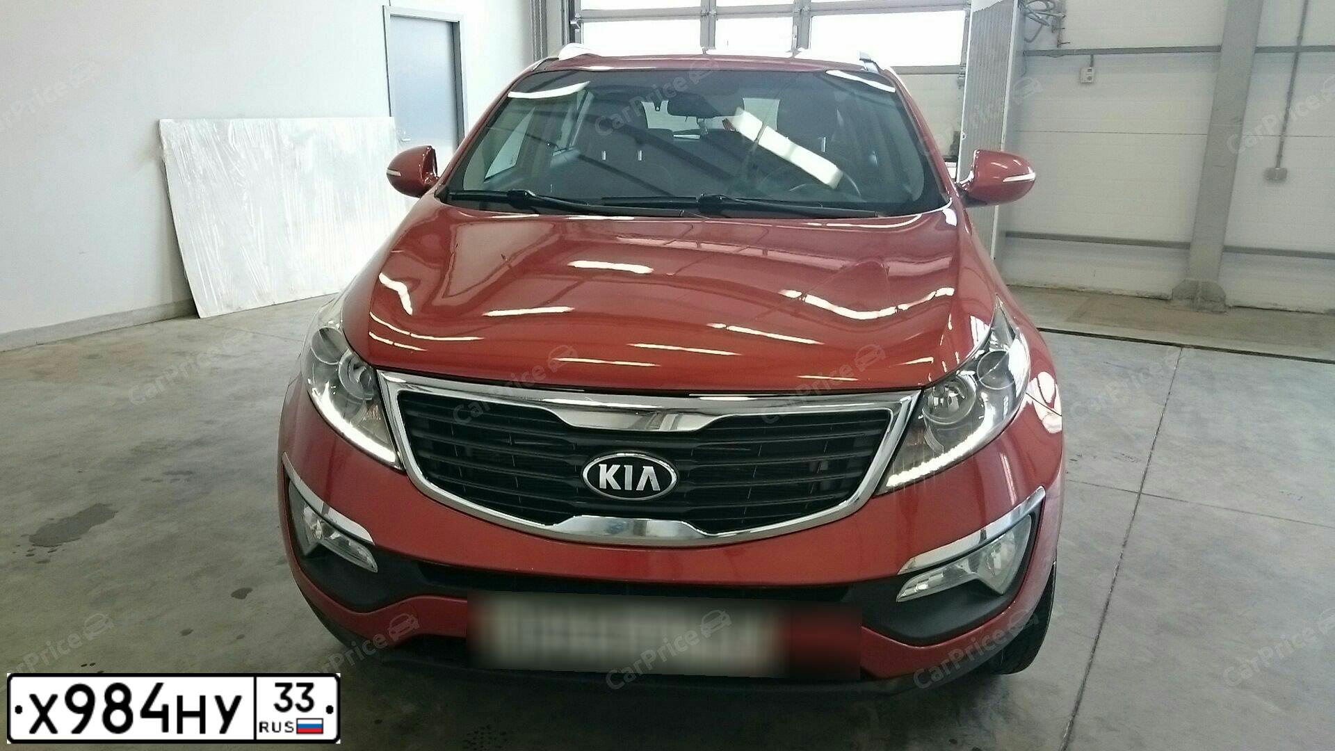 Фото автомобиля KIA SPORTAGE, 2011 — госномер Н203УР799. Цвет: Оранжевый