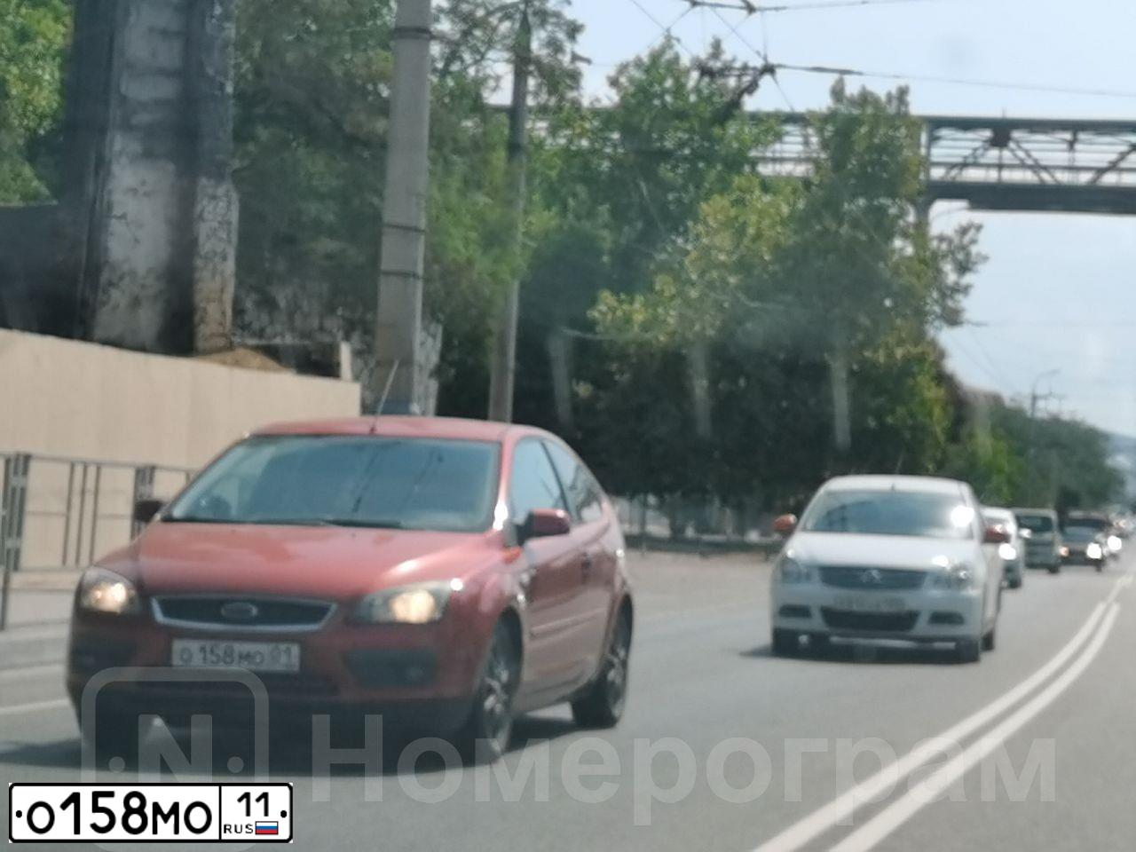 Фото автомобиля MITSUBISHI LANCER, 2007 — госномер А015ТМ51. Цвет: ЧЕРНЫЙ