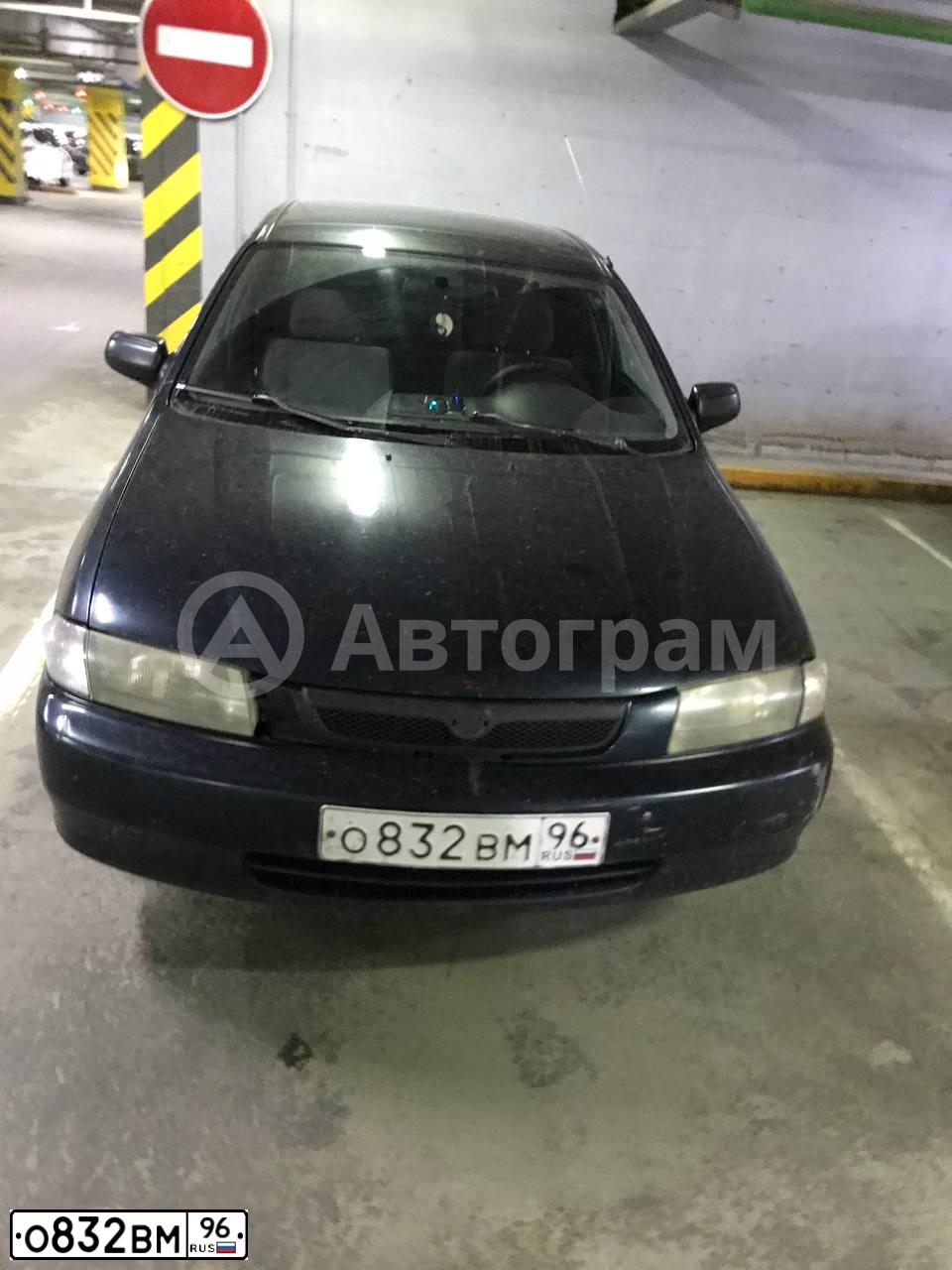 Фото автомобиля MAZDA 323, 1997 — госномер О720ОМ196. Цвет: Темно-синий