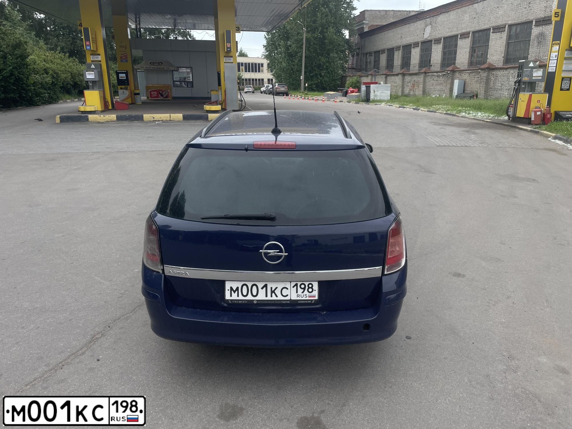 Фото автомобиля FORD FOCUS, 2007 — госномер М001КС198. Цвет: ТЕМНО-СЕРЫЙ