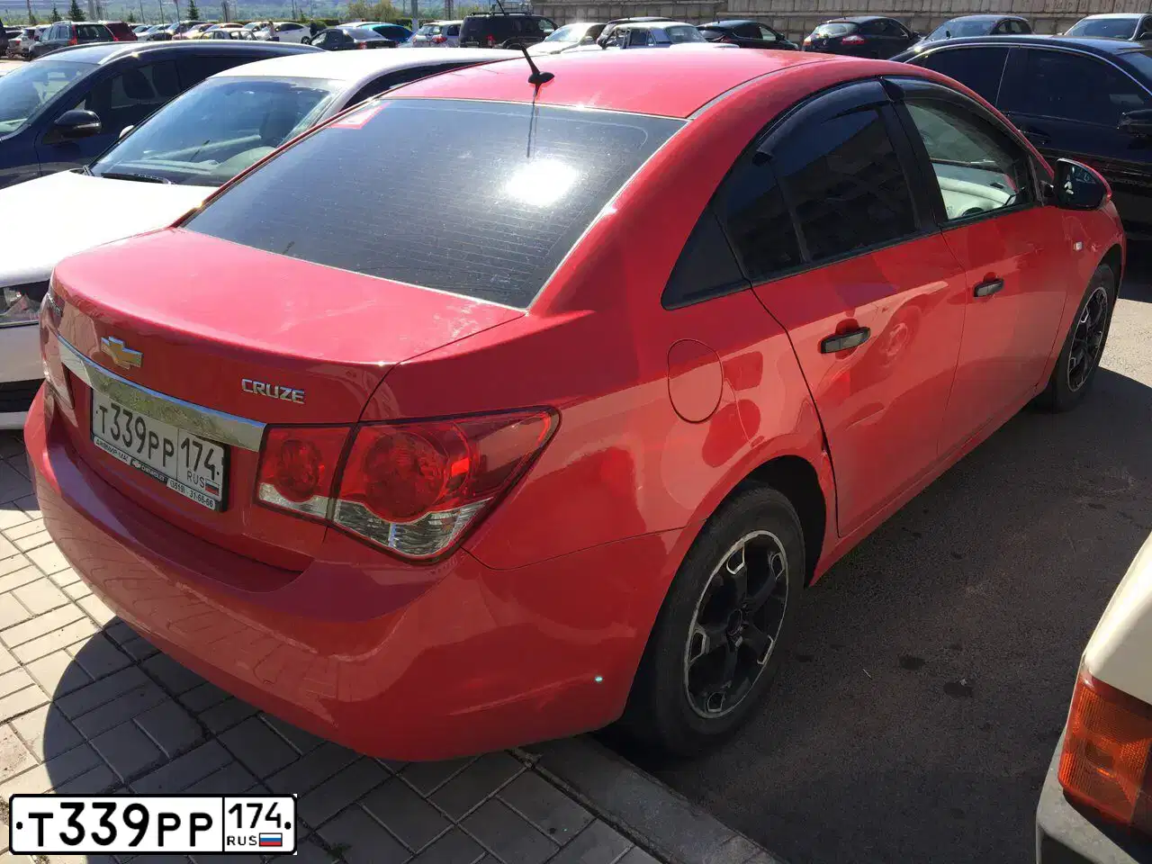 Фото автомобиля CHEVROLET CRUZE, 2012 — госномер К293АР702. Цвет: Красный