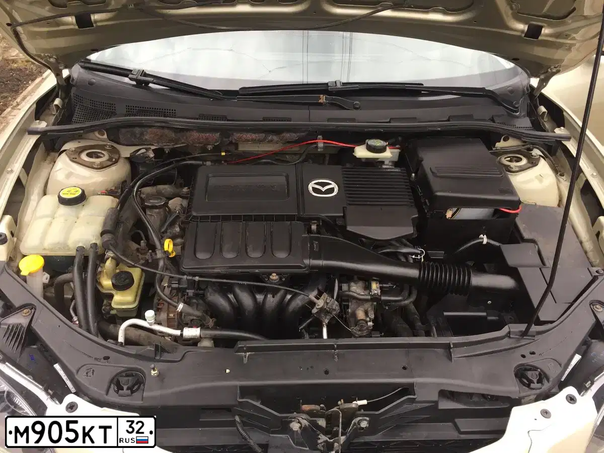 Фото автомобиля MAZDA 3, 2004 — госномер М905КТ32. Цвет: ЗОЛОТИСТЫЙ